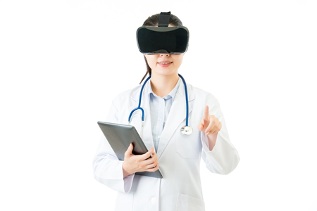 asian female doctor use digital tablet control virtual reality press screen. VR headset glasses device. white isolated background. medical and health conceptの写真素材