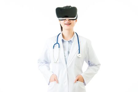 asian female doctor cross hand pocket reality press screen. VR headset glasses device. white isolated background. medical and health conceptの写真素材