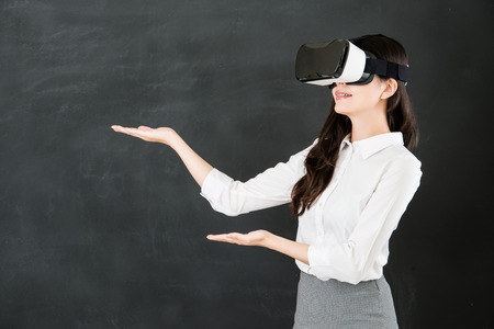 asian woman teacher presenting with virtual reality. VR headset glasses device. blackboard...