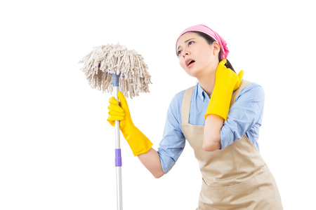 young attractive housewife suffer from neck pain after doing house cleaning feel tired and fatigued....