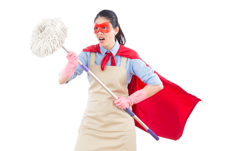 angry mad super mixed race asian housewife with cleaning work holding mop ready to fight. isolated on white background. housework and household concept.の写真素材