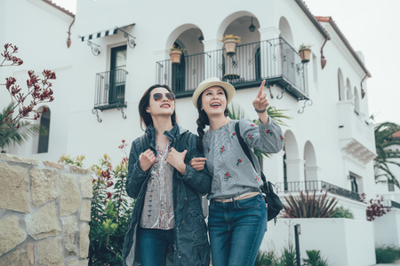 asian women friends on holiday vacation walking in Stearns Wharf in Santa Barbara.の写真素材