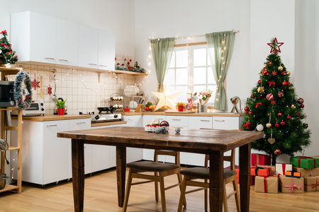 interior of a modern festive kitchen with wood furniture and window ready for celebrating Christmas holidayの写真素材