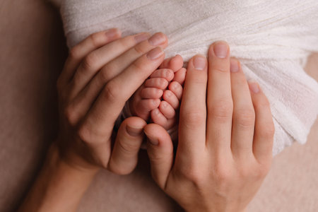 Mother holding her newborn baby in hands, closeup. baby care conceptの写真素材