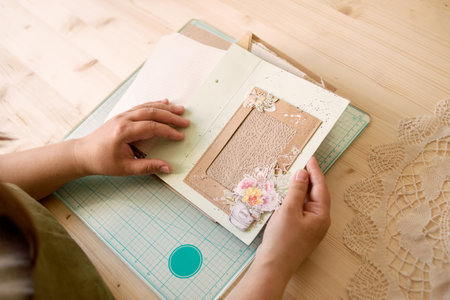 A creative person makes a scrapbook or notebook in their officeの写真素材