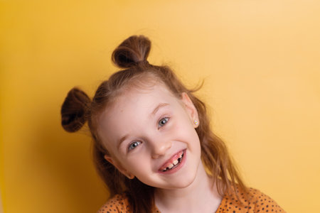 Portrait of a happy little girl showing a cute smile