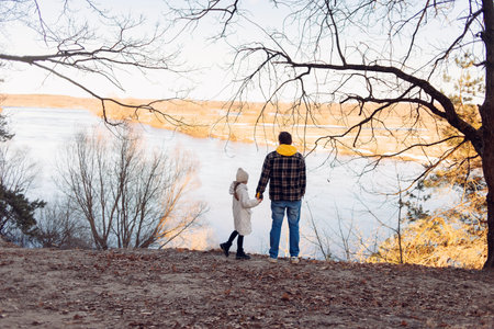 Happy Fathers Day concept: Father and daughter hold handsの写真素材