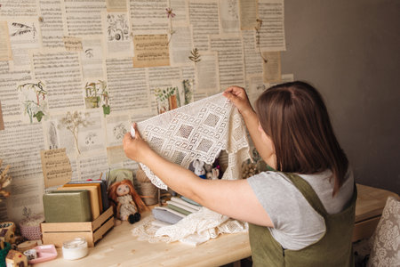 A creative person makes a scrapbook or notebook in their office. Handmadeの写真素材