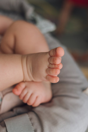 Small baby legs close-up, vertical photoの写真素材