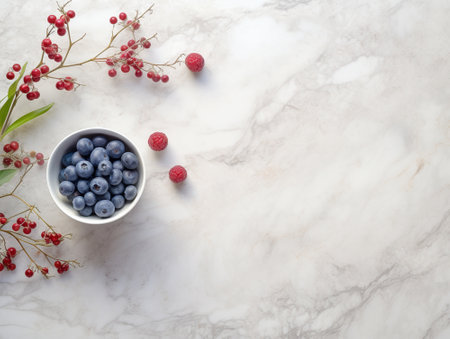 blueberries in a small plate on a marble background with space for textの素材