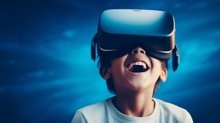 a surprised child in a VR-headset with a wide smile on his face enjoying the experience of virtual reality. High quality photoの素材