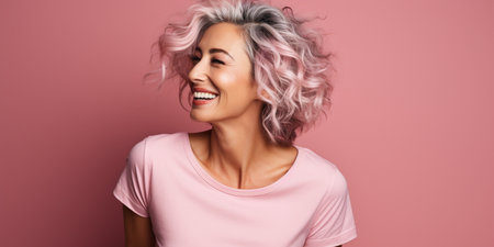 beautiful woman with colorful hair and a beautiful smile on a pink backgroundの素材