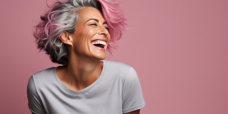 beautiful woman with colorful hair and a beautiful smile on a pink backgroundの素材