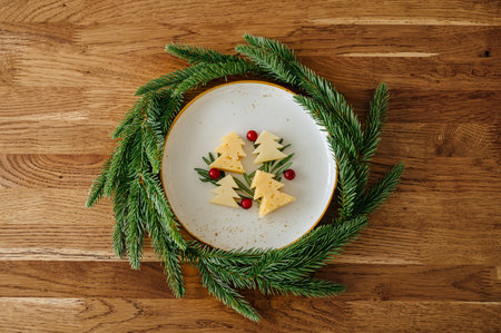 Christmas snack in the form of trees. Delicious cheese with christmas background. High quality photoの写真素材