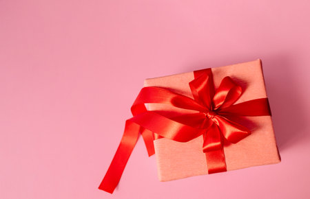 Valentines day gift. Banner design with present box and hearts on pink background. High qualityの写真素材