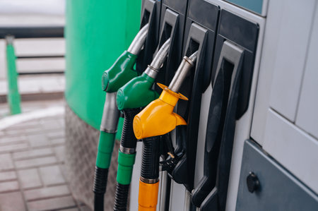 Gas station. Pistols with gasoline and diesel fuel at a car gas station, oil business concept. High