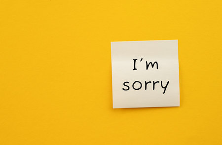 Sticker with inscription I'm sorry on yellow background, apology message design . High quality photoの写真素材