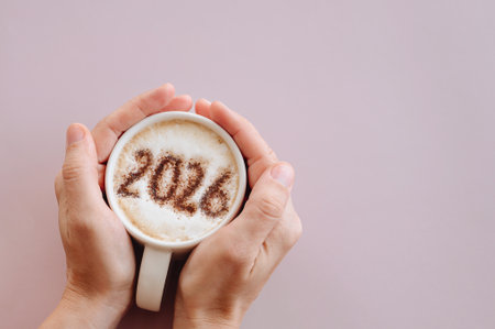 woman enjoying hot coffee. On milk foam numbers 2026. High quality photo