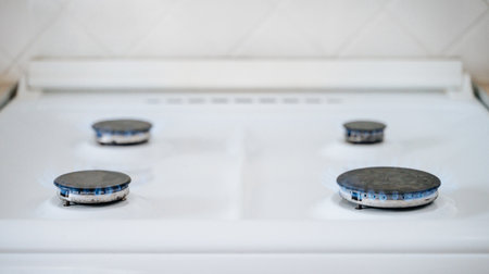 Gas stove with blue flame.の写真素材