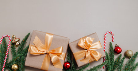 Gift box with bow and fir branches, Christmas decorations, space for text