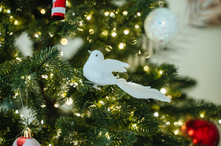 Close-up of Christmas tree decorations. Garlands bokeh in the background.の写真素材