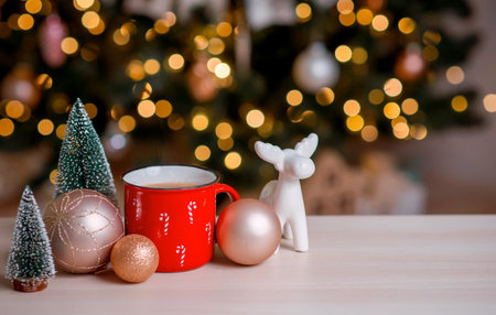 Red mug of hot cocoa with marshmallows and homemade Christmas gingerbread cookies.の写真素材