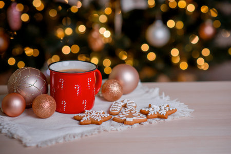 Red mug of hot cocoa with marshmallows and homemade gingerbread cookies.. High quality photoの写真素材