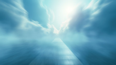Blurred road or tunnel leading toward bright sunlight through cloudsの写真素材