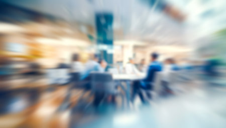 Long exposure of business people walking through a bright modern office, dynamic motionの写真素材
