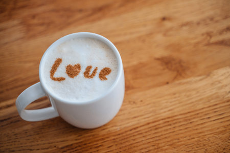 Cappuccino with love text on milk foam, cozy coffee break and romance concept.の写真素材