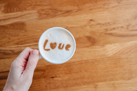 Cappuccino with love text on milk foam, cozy coffee break and romance concept.の写真素材