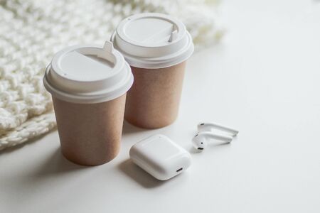 flat lay white, two glasses for coffee or tea, wireless headphonesの写真素材