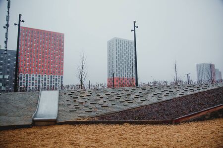 12.2019, Moscow: new modern multi-storey building district in new Moscow in the fog, playground