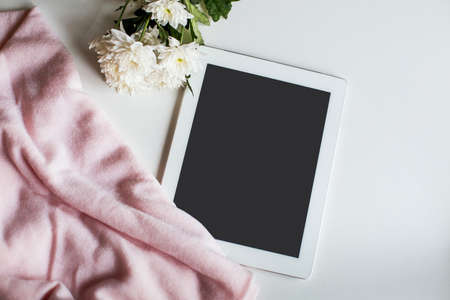 pink fabric, delicate white flowers and a tablet or tablet for your text 1の写真素材