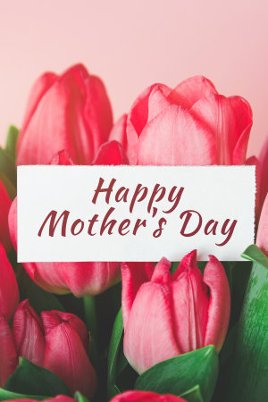 white card with the inscription Happy mothers day in a bouquet of beautiful tulips, the concept of...