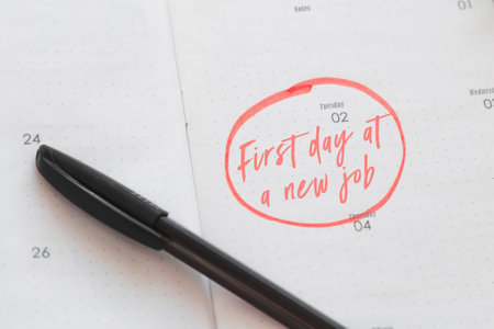 planner with the date highlighted the description first day on a new job, career concept.の写真素材