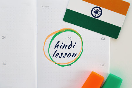 calendar planner notebook with date inscription hindi lesson marked and circled with marker, national flag of India, education foreign languages concept.の写真素材