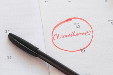 calendar planner notebook with description chemotherapy date marked and circled with marker, cancer treatment concept.の写真素材