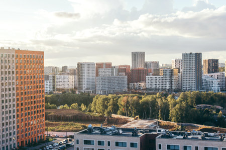 Panoramic view of a modern residential district with high-rise apartment buildings and green areas concept of urban development, city expansion, and modern housing infrastructureの写真素材
