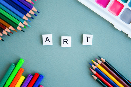 flat lay on the theme of drawing and creativity: colored pencils, watercolor, felt-tip pens, inscription art 1の写真素材