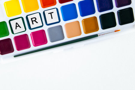 inscription art on a palette of colorful watercolor paints, place for textの写真素材