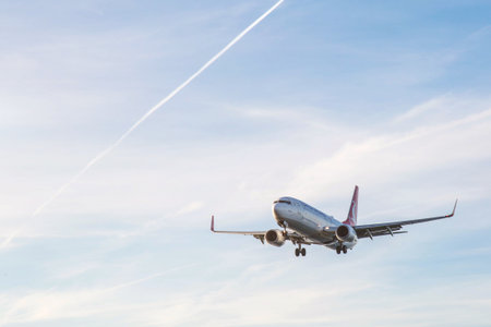 11/22/2025, Batumi, Georgia: Passenger airplane of Turkish airlines approaching runway for landing against blue sky, commercial aviation concept, travel, air transport, tourism industry, copy spaceのeditorial素材