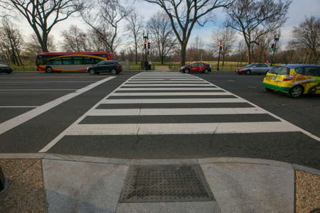 Spring, 2016 - Washington DC, USA - Empty well-groomed pedestrian crossing over the central road in...