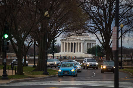 Spring, 2016 - Washington DC, USA - Cars drive along the road in the background of the Lincoln...