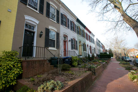 Spring, 2016 - Washington DC, USA - Residential Real Estate. Cozy beautiful townhouses in the center of the capital of America among the trees and shrubs.のeditorial素材