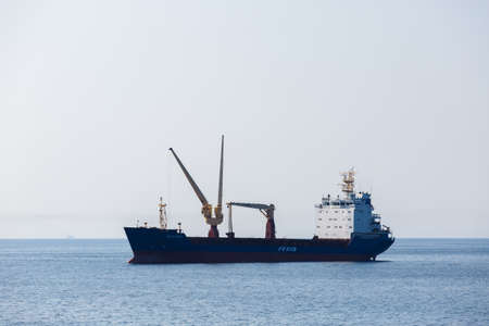 Summer, 2016 - Vladivostok, Russia - A merchant ship stands on the roadstead in the Golden Horn Bay...