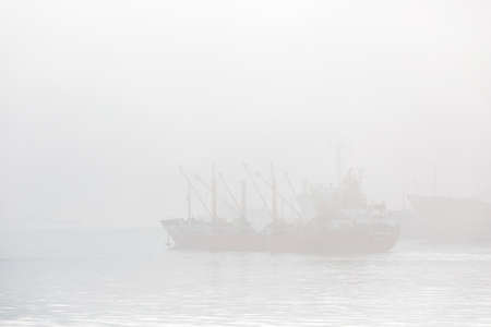 Various merchant ships stand on the roadstead in the Golden Horn Bay in Vladivostokの写真素材