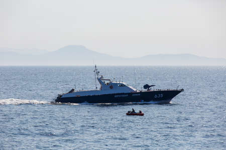 A Coast Guard boat goes at high speed through the water area of Vladivostokのeditorial素材