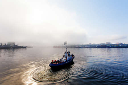 A Coast Guard boat goes at high speed through the water area of Vladivostokのeditorial素材