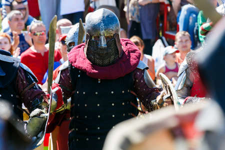 Knight Tournament. Medieval restorers fight with swords in armor at a knightly tournamentのeditorial素材